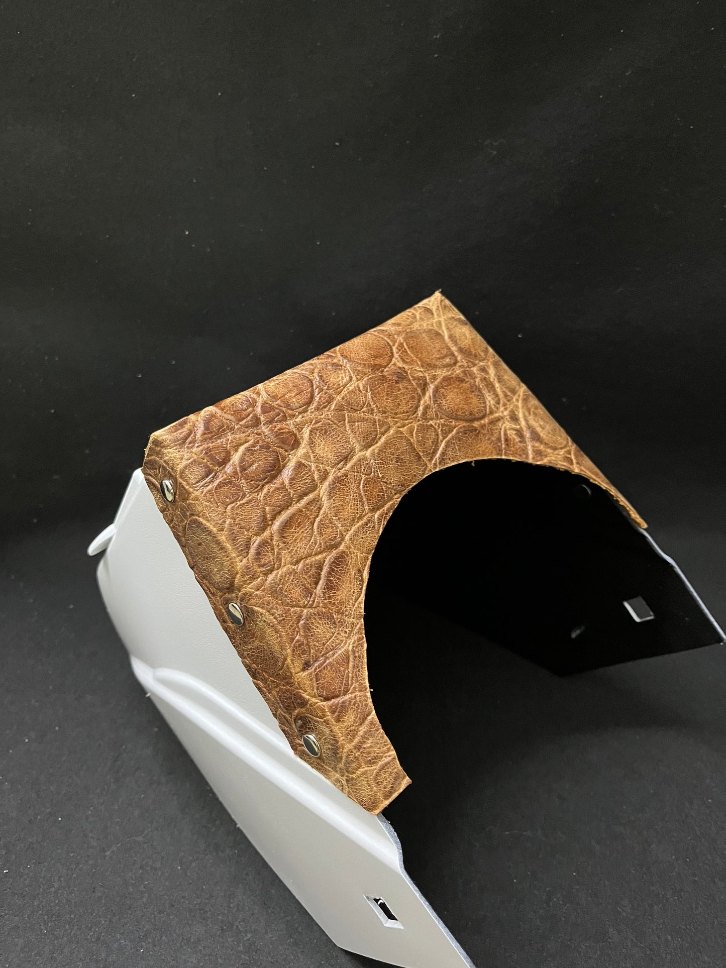 White hood with a turtle embossed leather