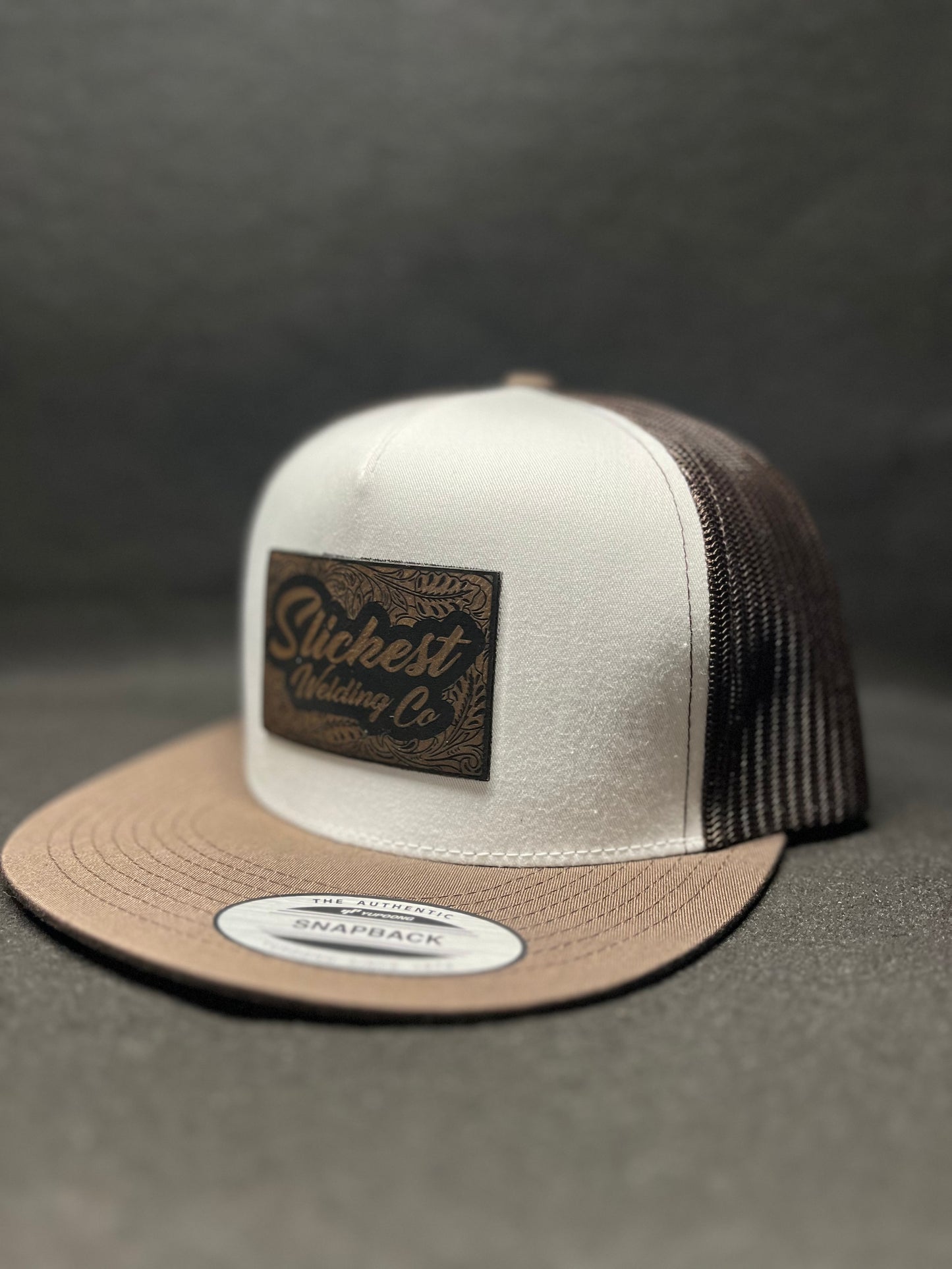 Brown with white hat with a brown patch