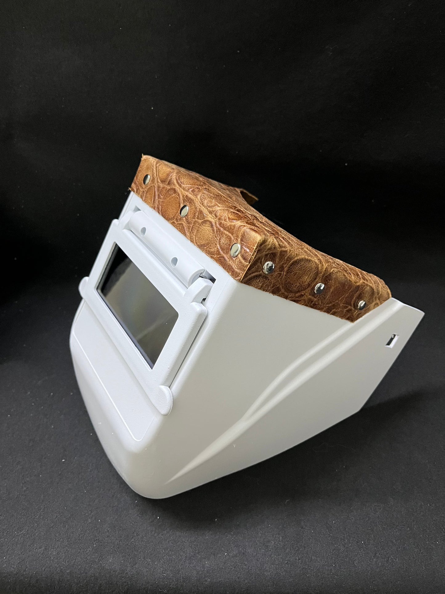 White hood with a turtle embossed leather