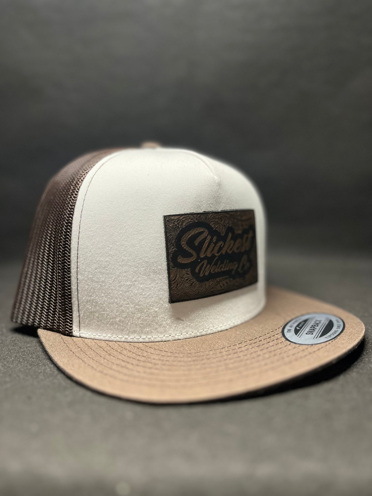 Brown with white hat with a brown patch