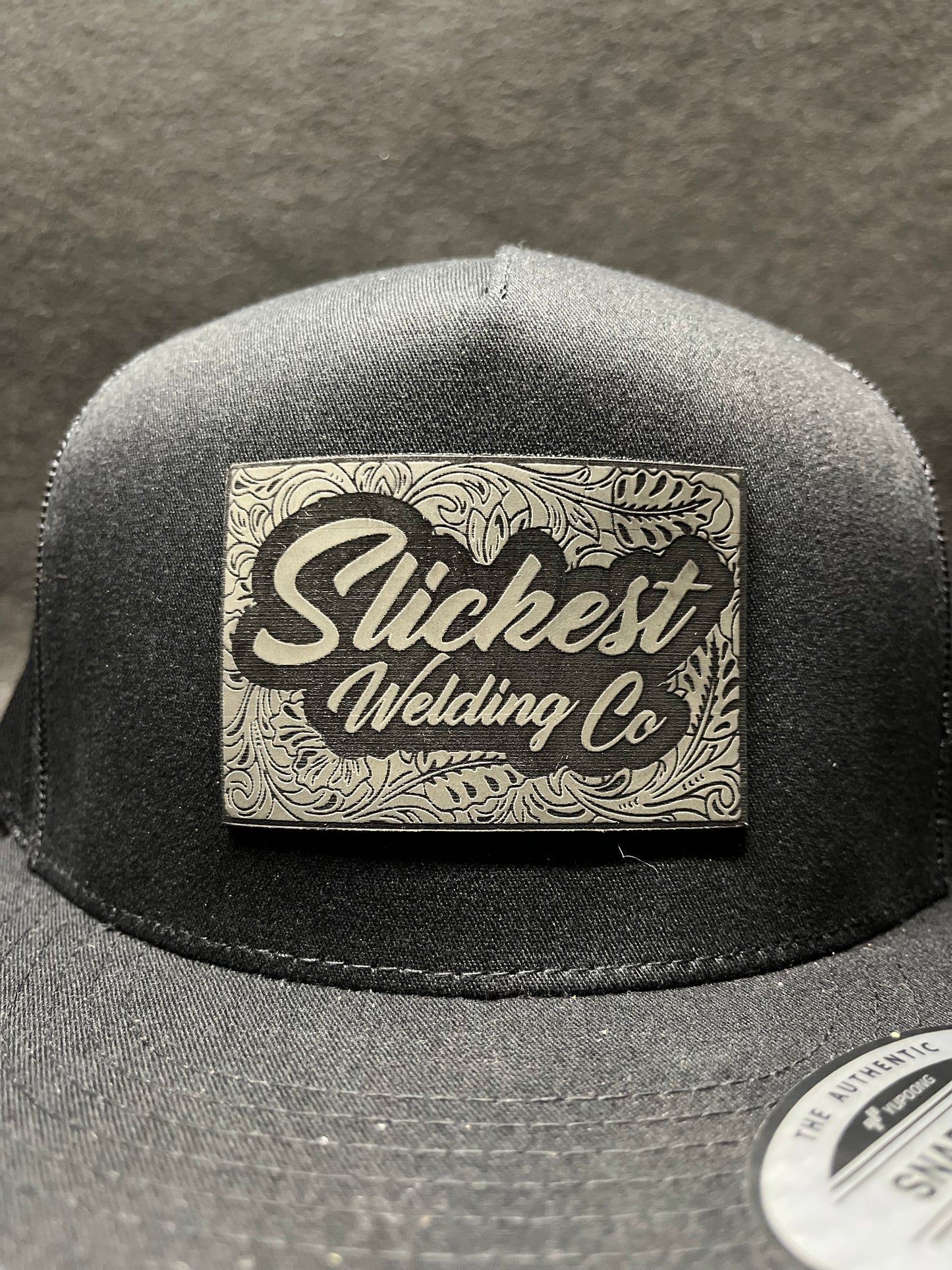 Black hat with dark grey patch
