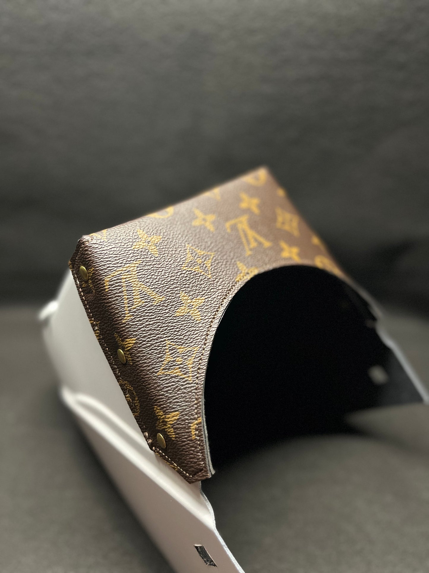 White hood with a brown lv top bib