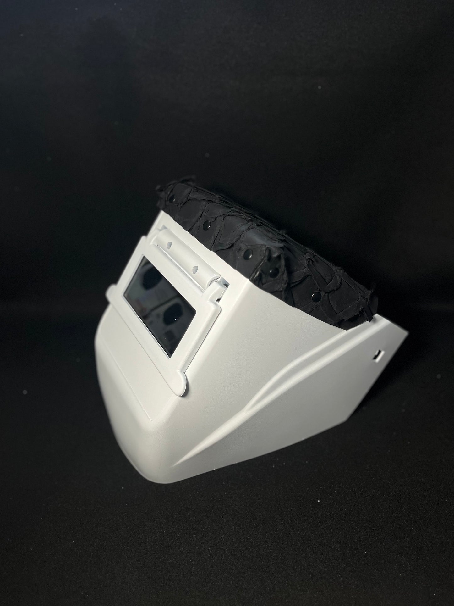 White hood with a matte black pirarucu top bib