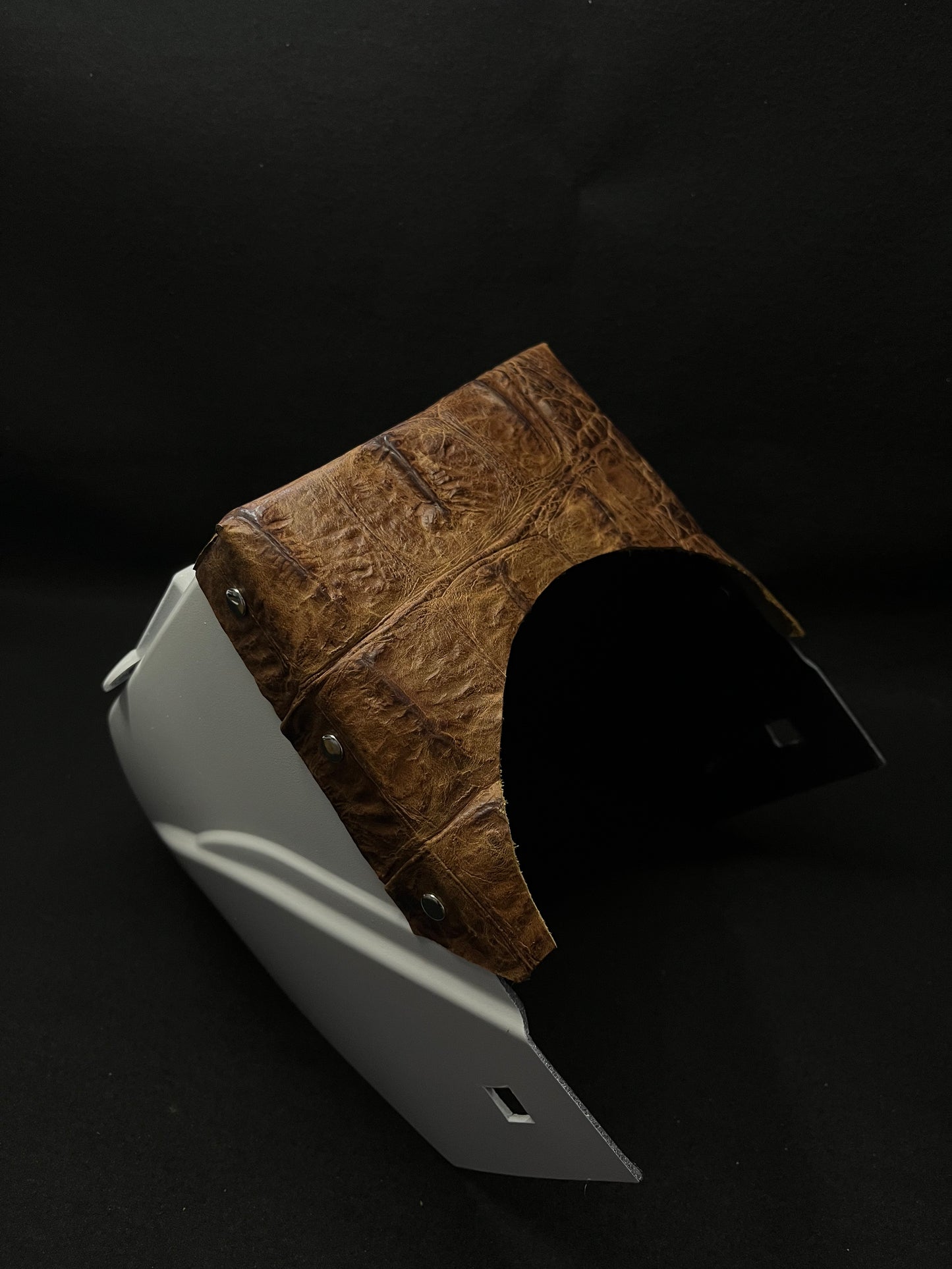 White hood with a brown gator top bib