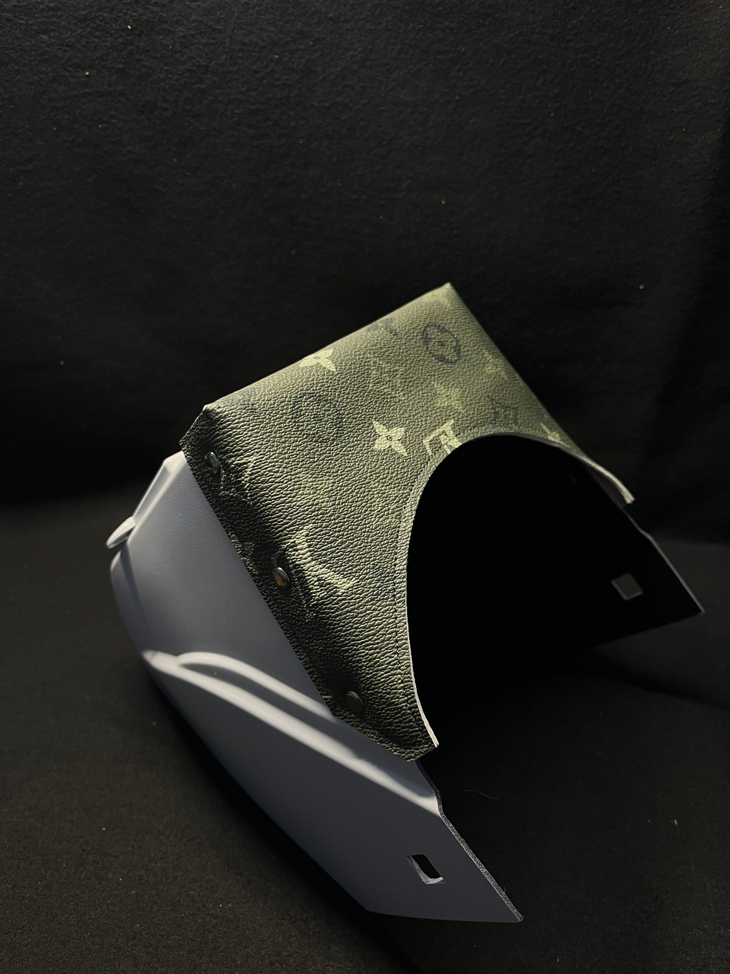 White hood with an olive green LV top bib