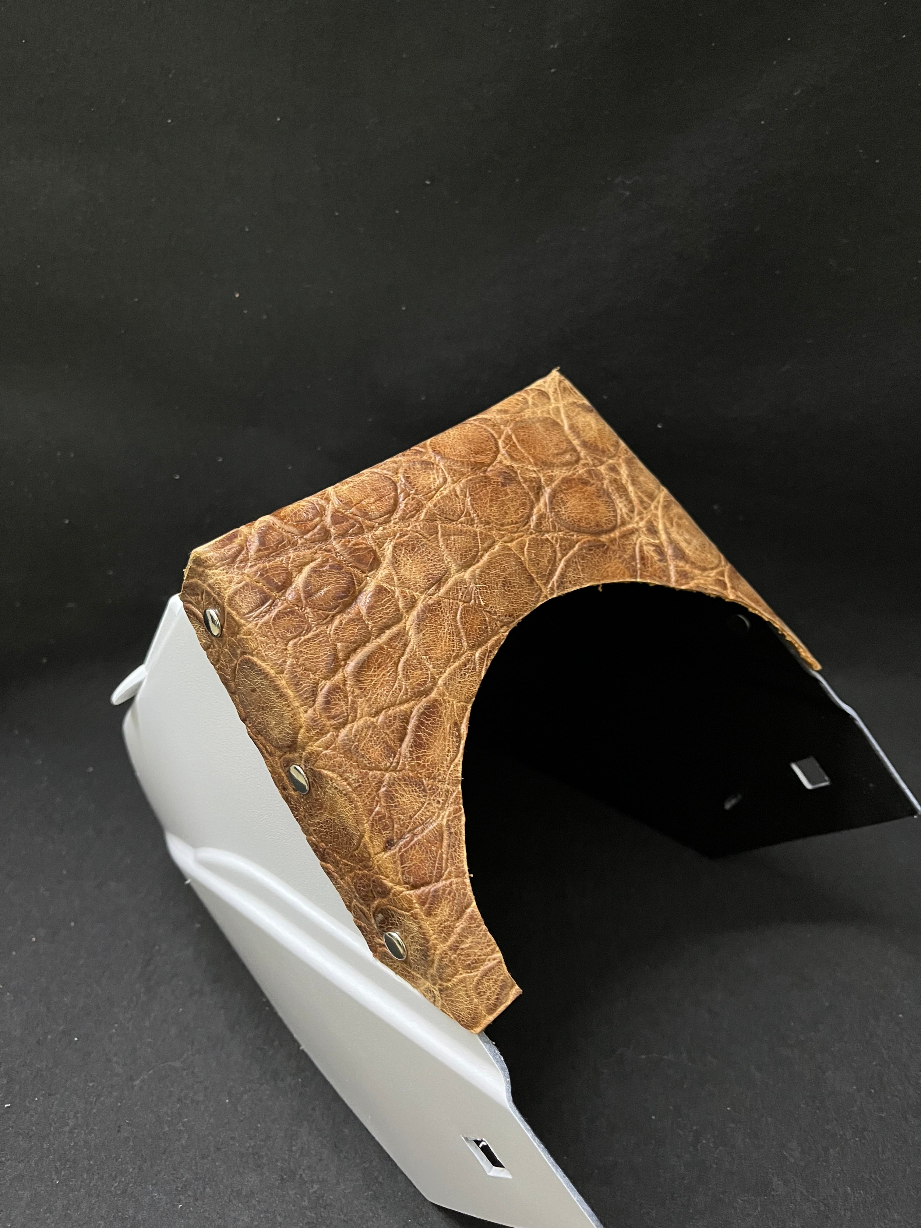 White hood with a turtle embossed leather