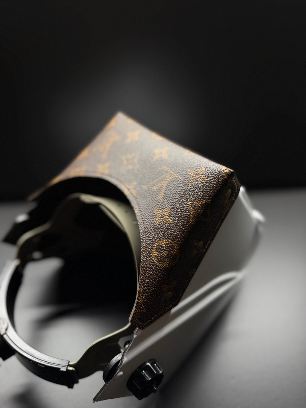 White hood with a brown lv top bib