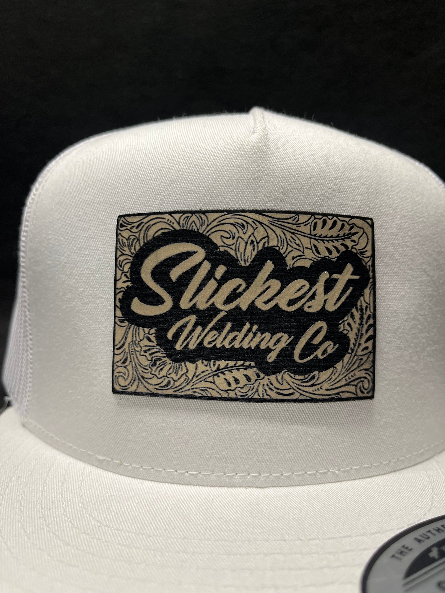 White hat with a tan patch