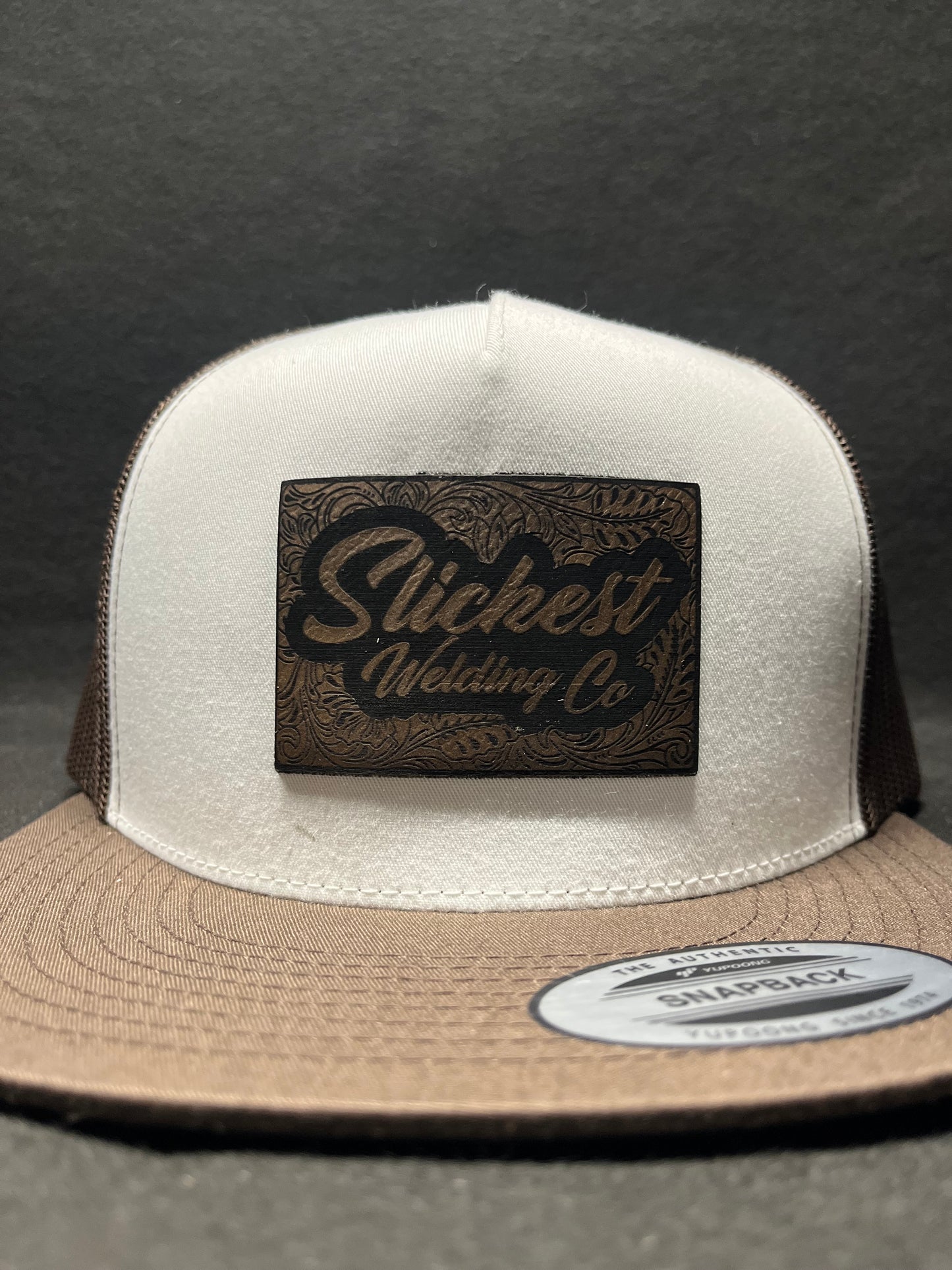 Brown with white hat with a brown patch