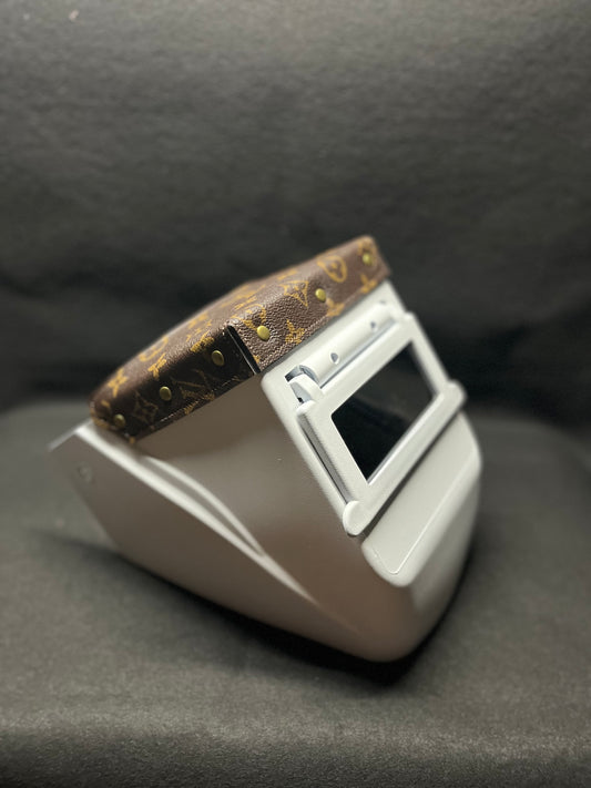 White hood with a brown lv top bib