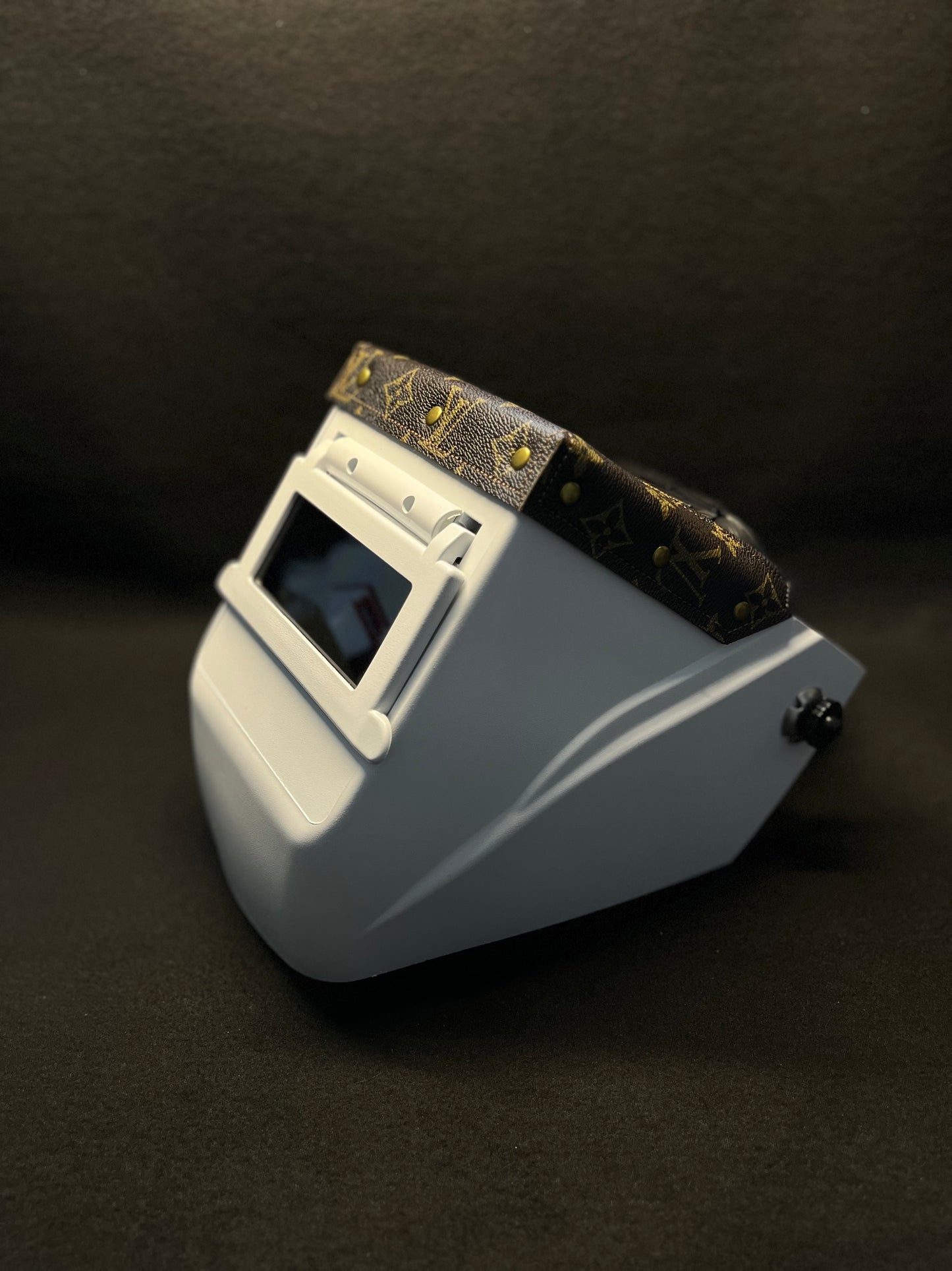 White hood with a brown lv top bib