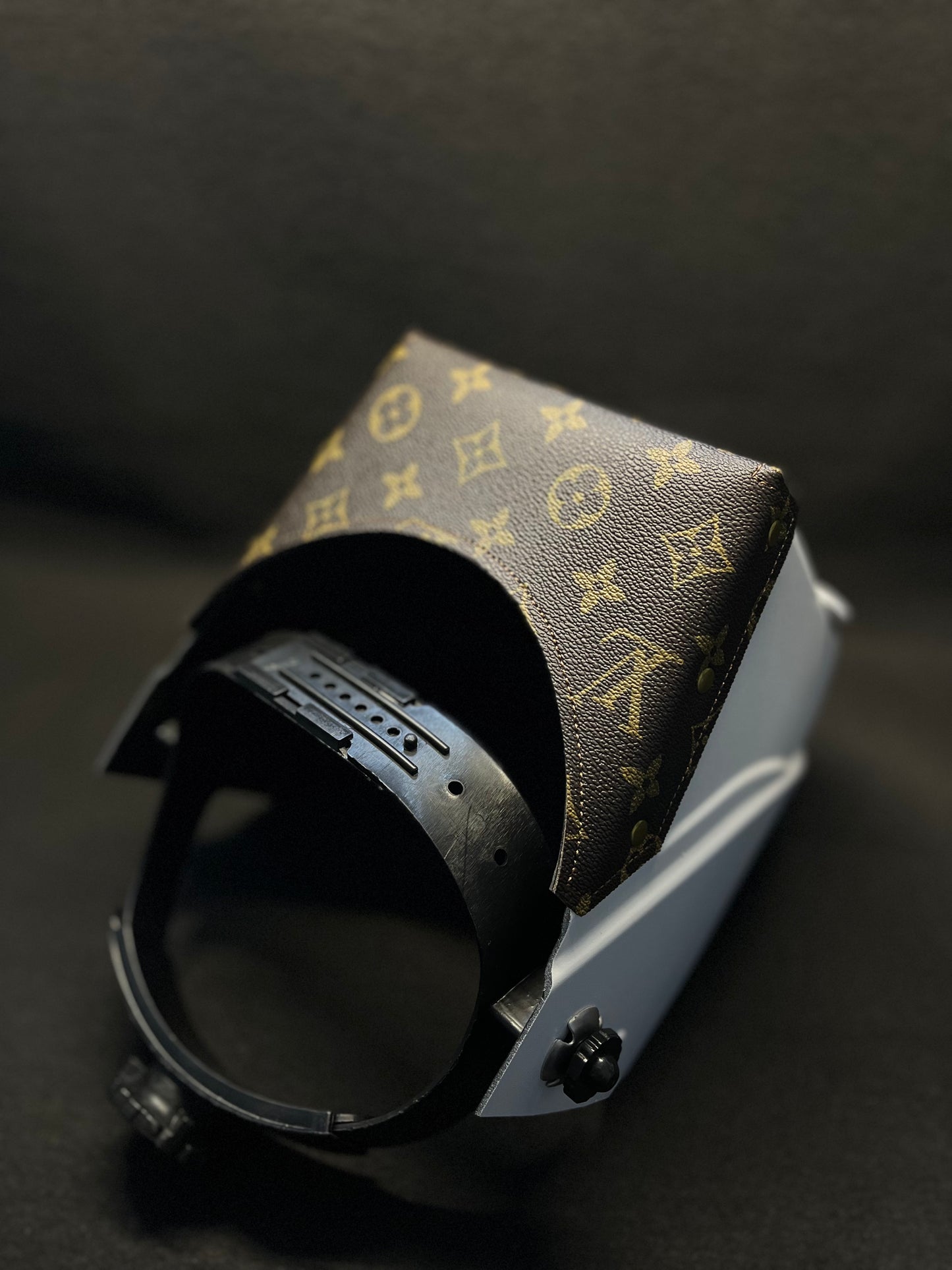 White hood with a brown lv top bib