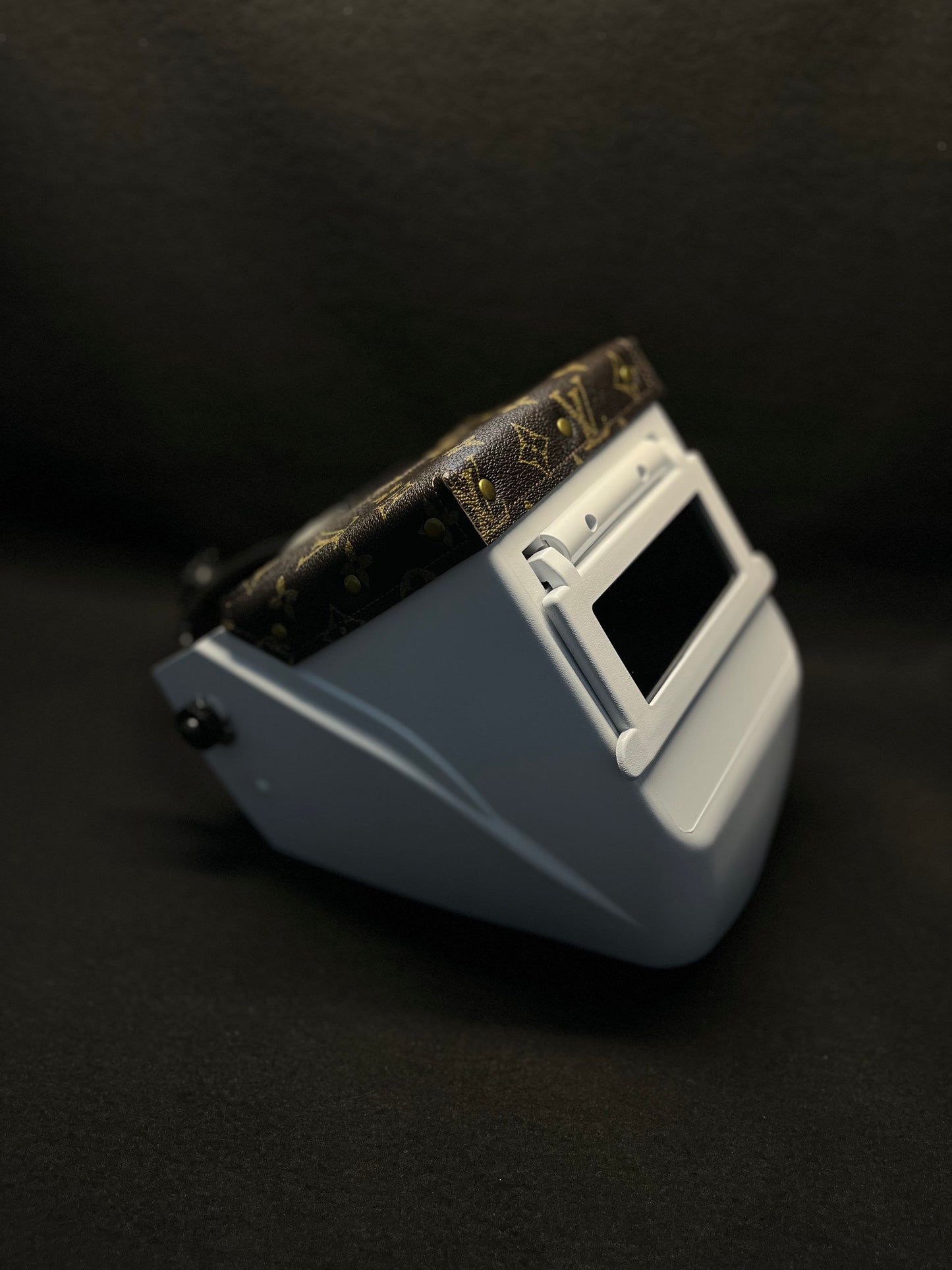 White hood with a brown lv top bib