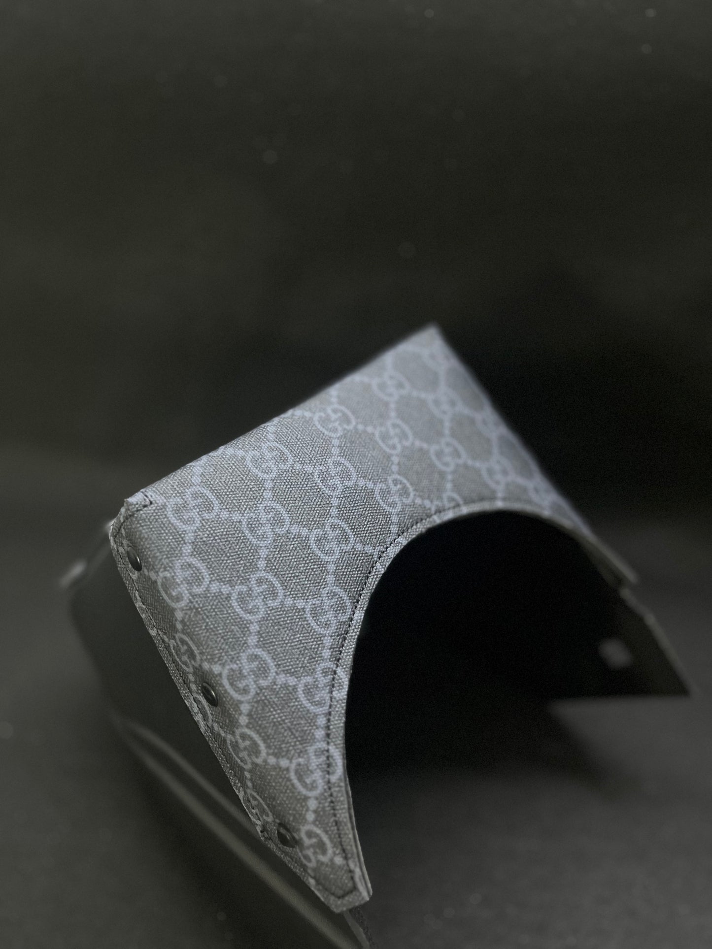 Black hood with a black GG top bib