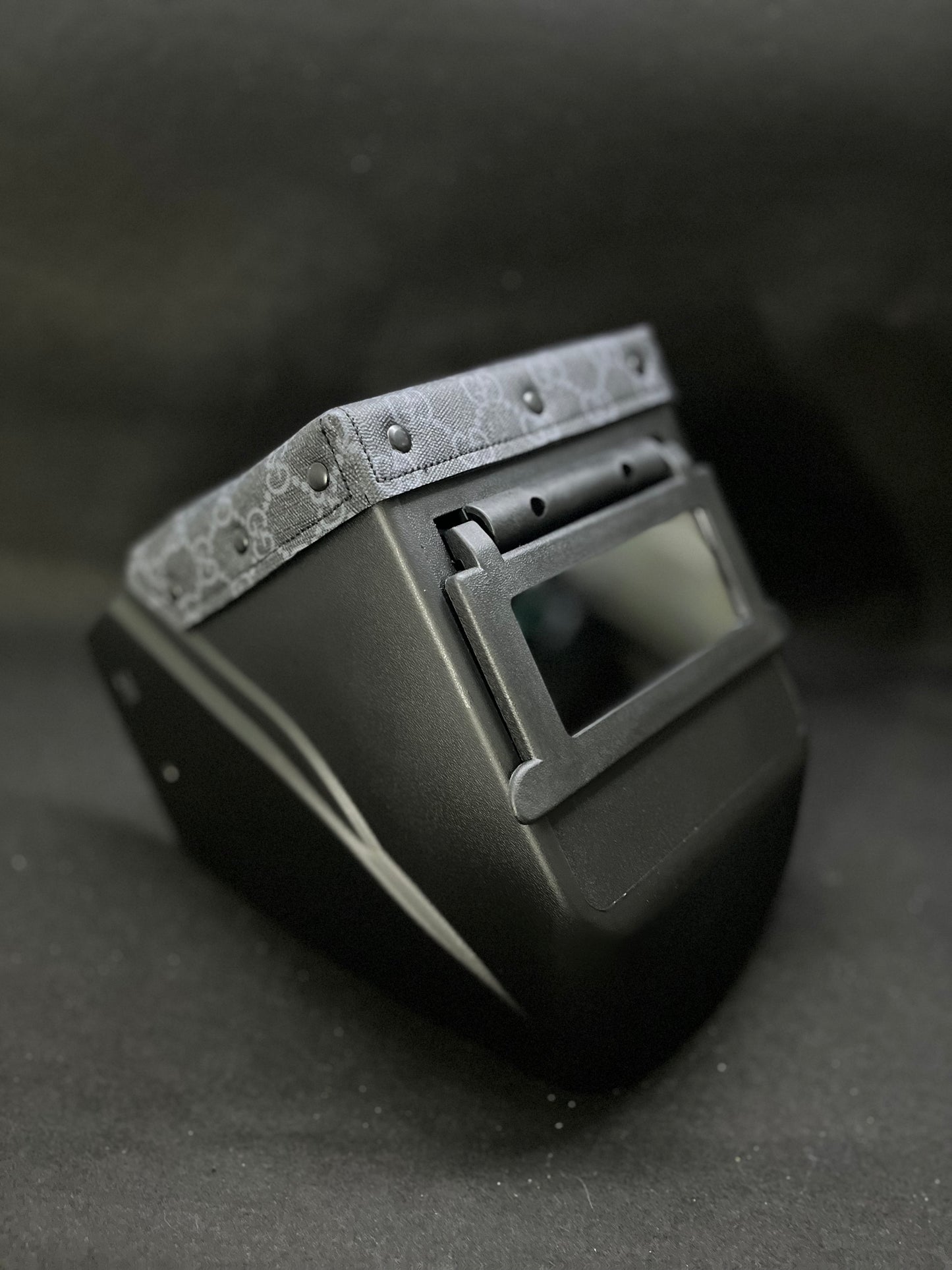 Black hood with a black GG top bib