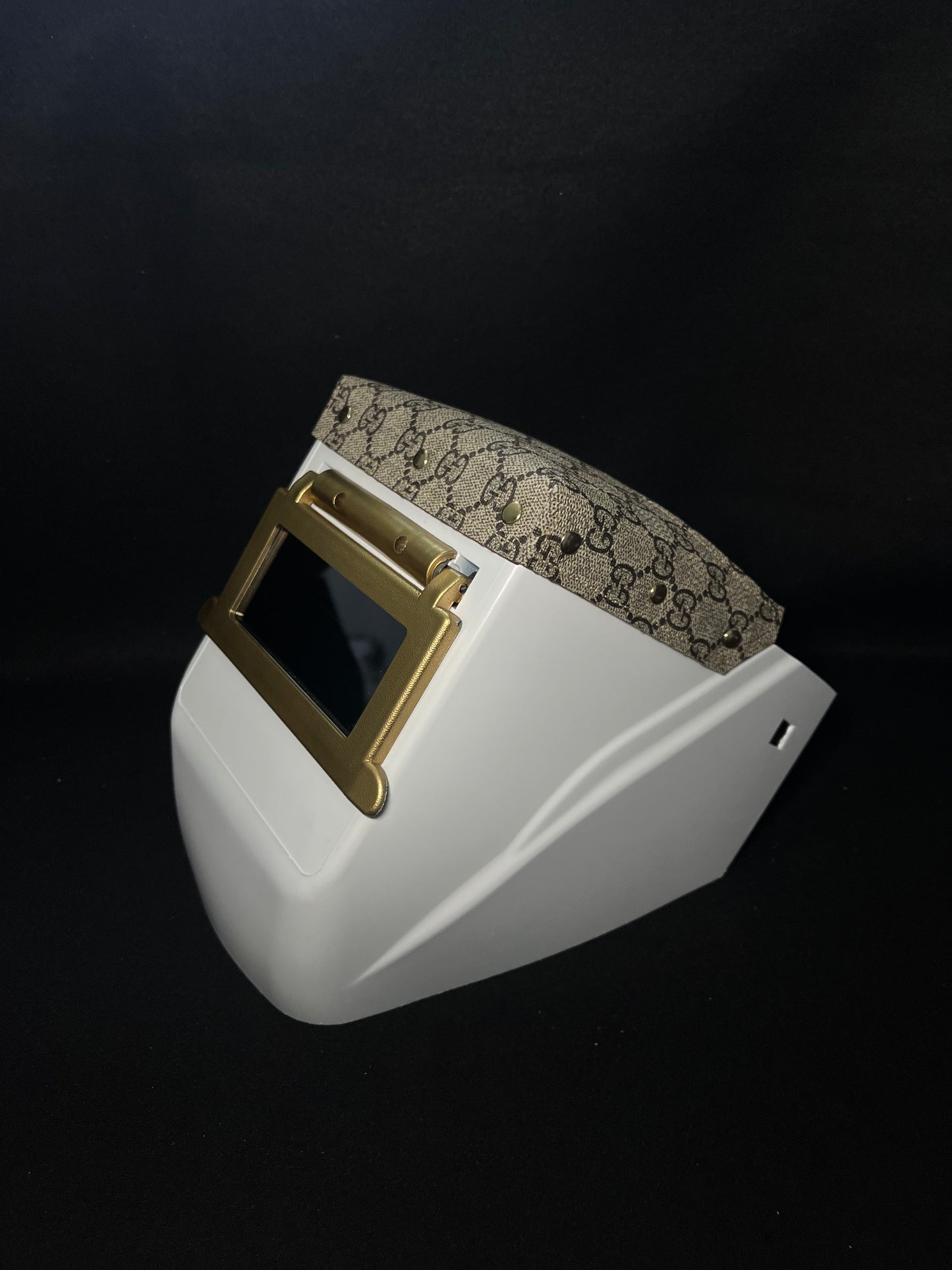 White hood with a gucci top bib and gold accents