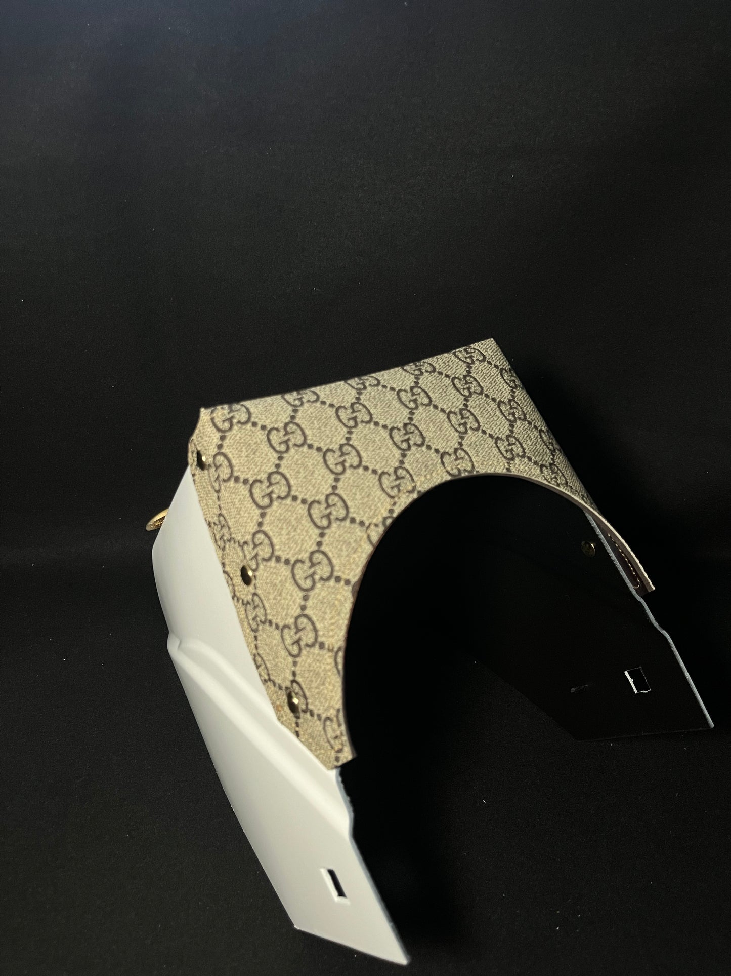 White hood with a gucci top bib and gold accents